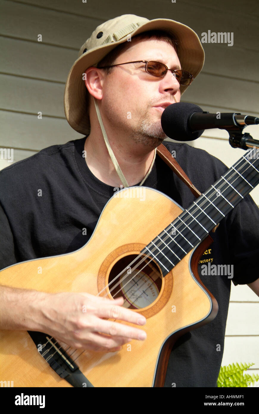 Male musicians play guitar and harmonica Stock Photo Alamy