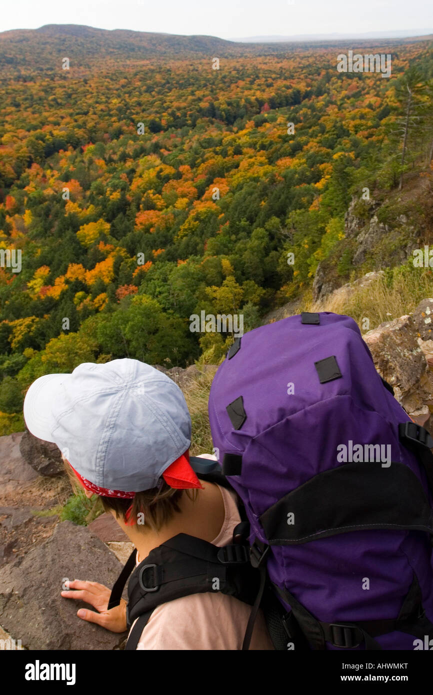 A female backpacker at Porcupine Mountains State Park in fall in