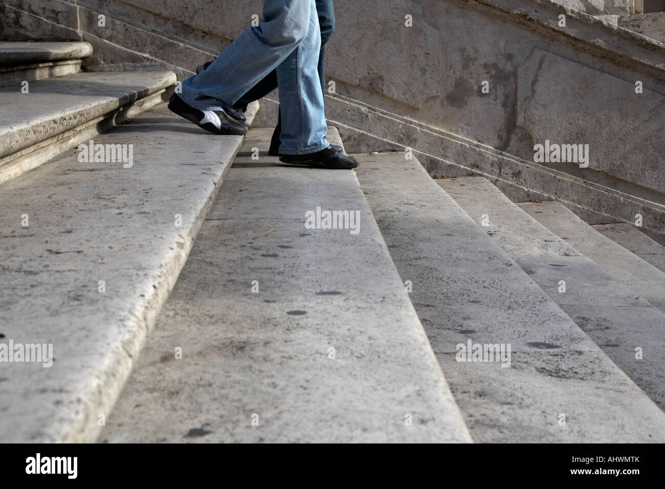 two peoples feet walk down the spanish steps Rome Lazio Italy Stock