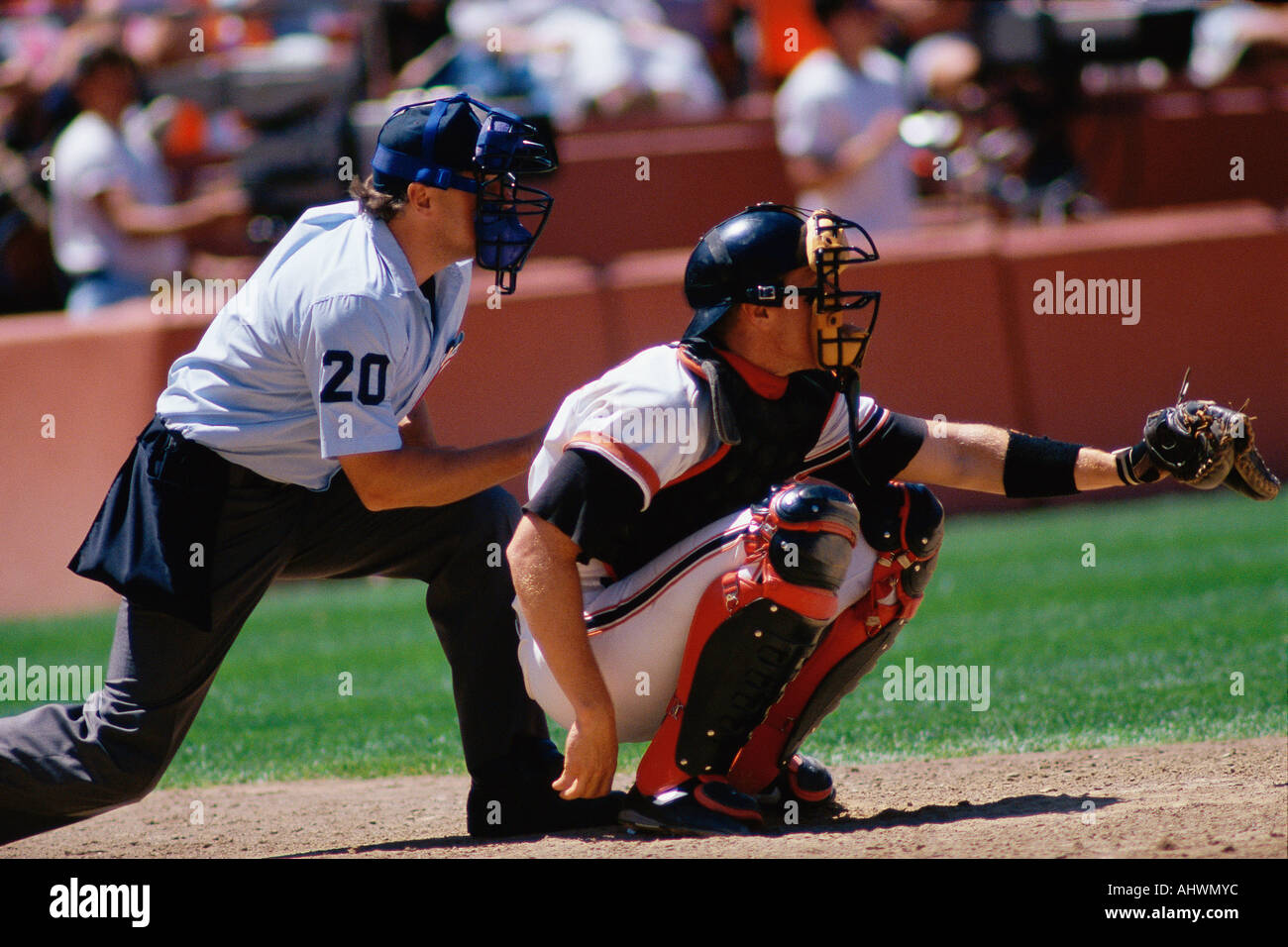 Baseball catcher and umpire at game Stock Photo Alamy