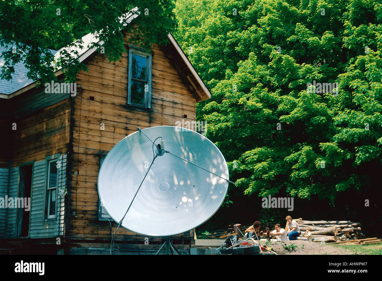 House with satellite dish in yard Stock Photo Alamy