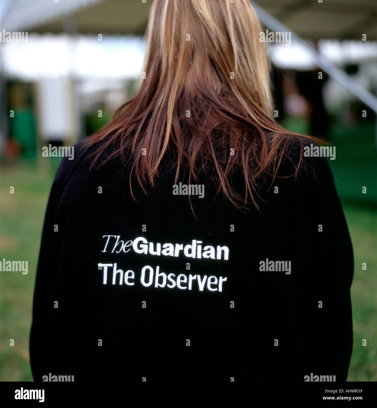 A woman wearing a jacket saying Guardian and Observer at the Hay Festival Hay on Wye Powys Wales UK Stock Photo