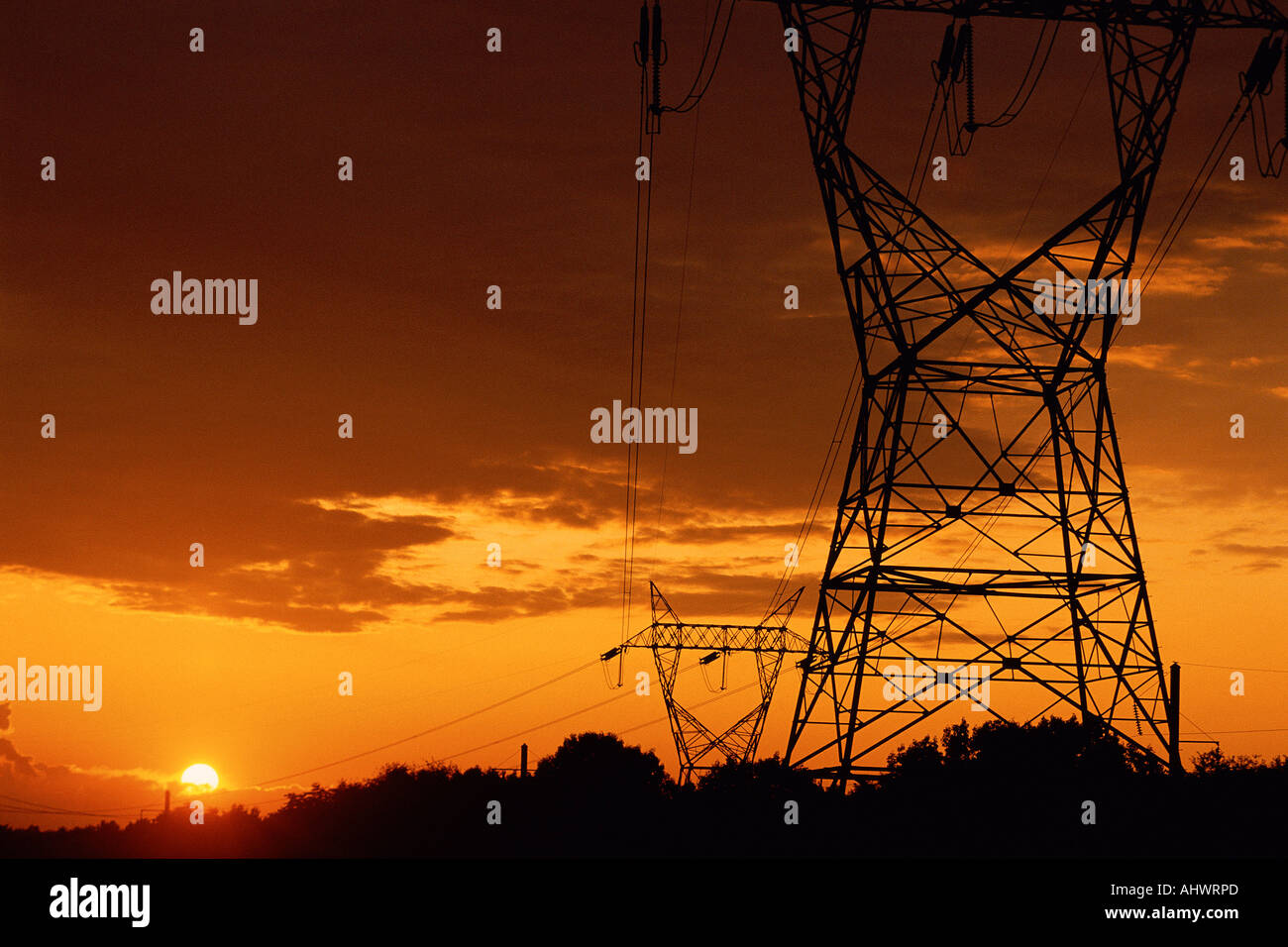 Power lines silhouetted by setting sun Stock Photo - Alamy