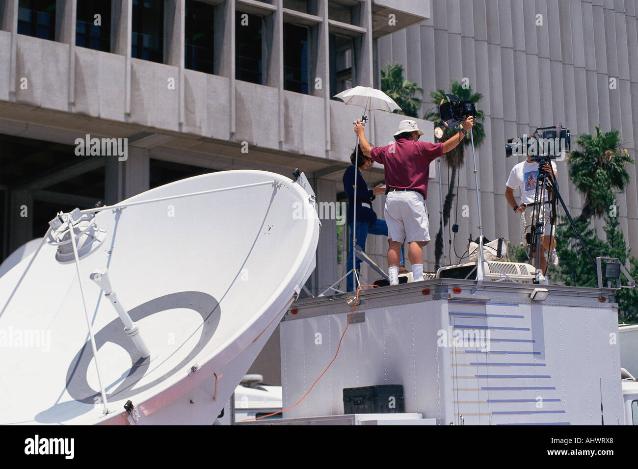 News crew setting up coverage Stock Photo