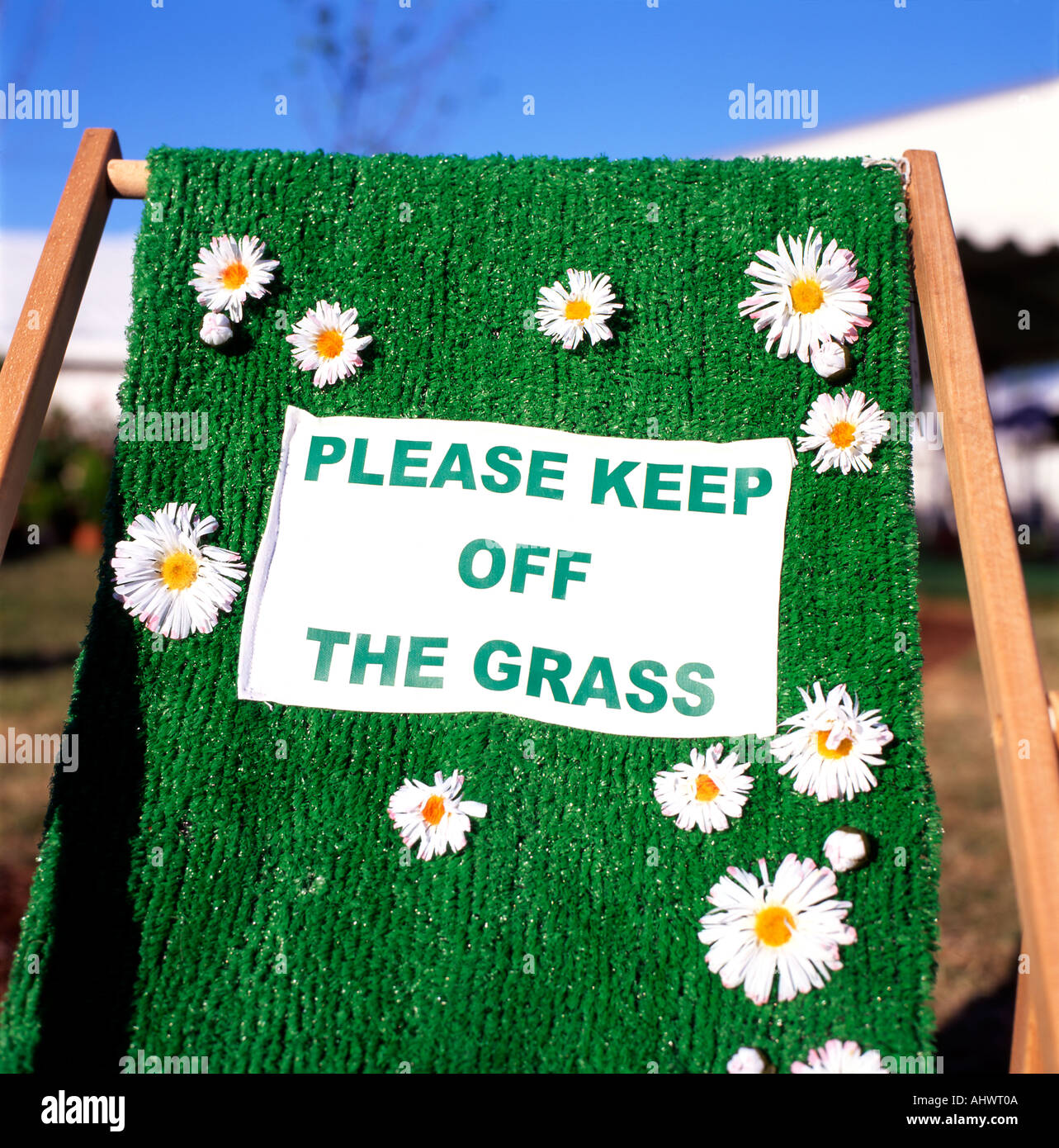 Please Keep off The Grass sign on a deck chair Hay Festival Hay on Wye Powys Wales UK Stock Photo