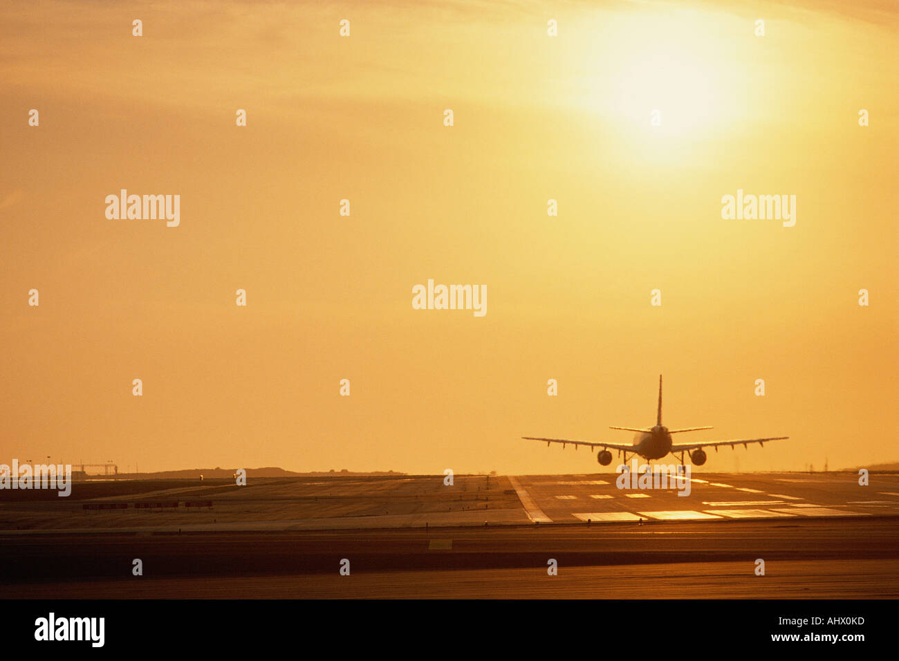 Airplane on runway Stock Photo - Alamy
