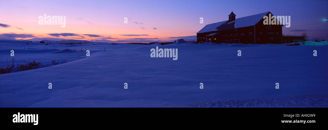 Shed in snow in dwindling twilight Vermont Stock Photo