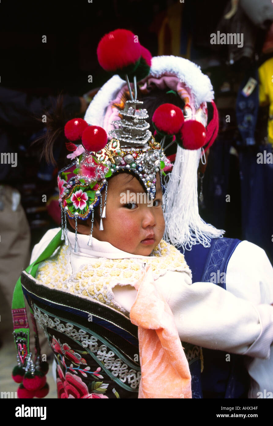 China Yunnan Dali Wase Bai baby wearing traditional hat Stock Photo