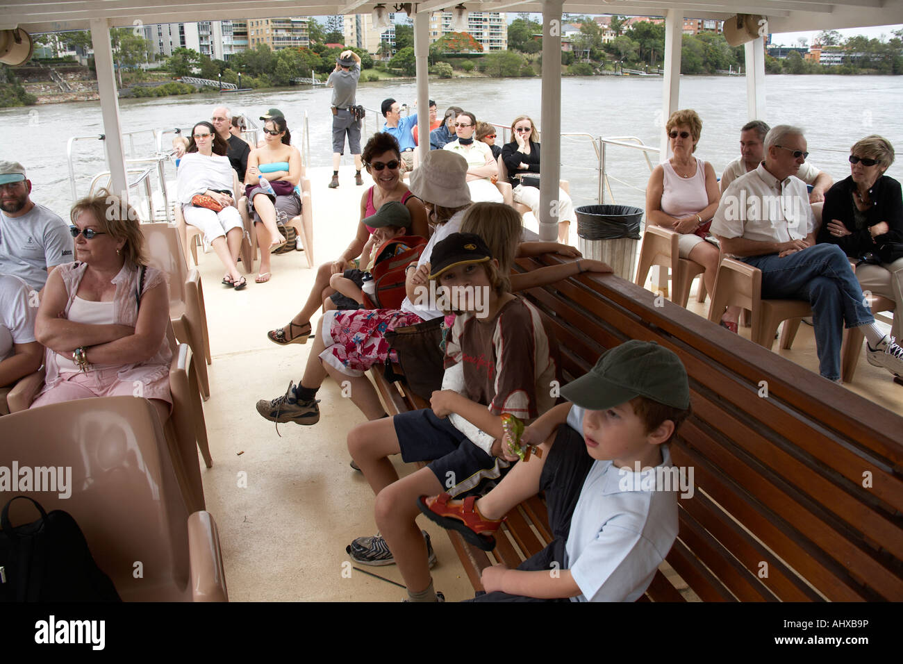 Passengers aboard cruise boat on Brisbane River in Brisbane Queensland QLD Australia Stock Photo
