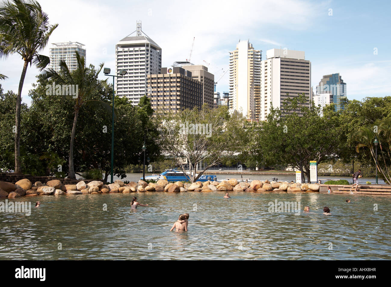 People swimming in pool by artificial Streets beach on South Bank in