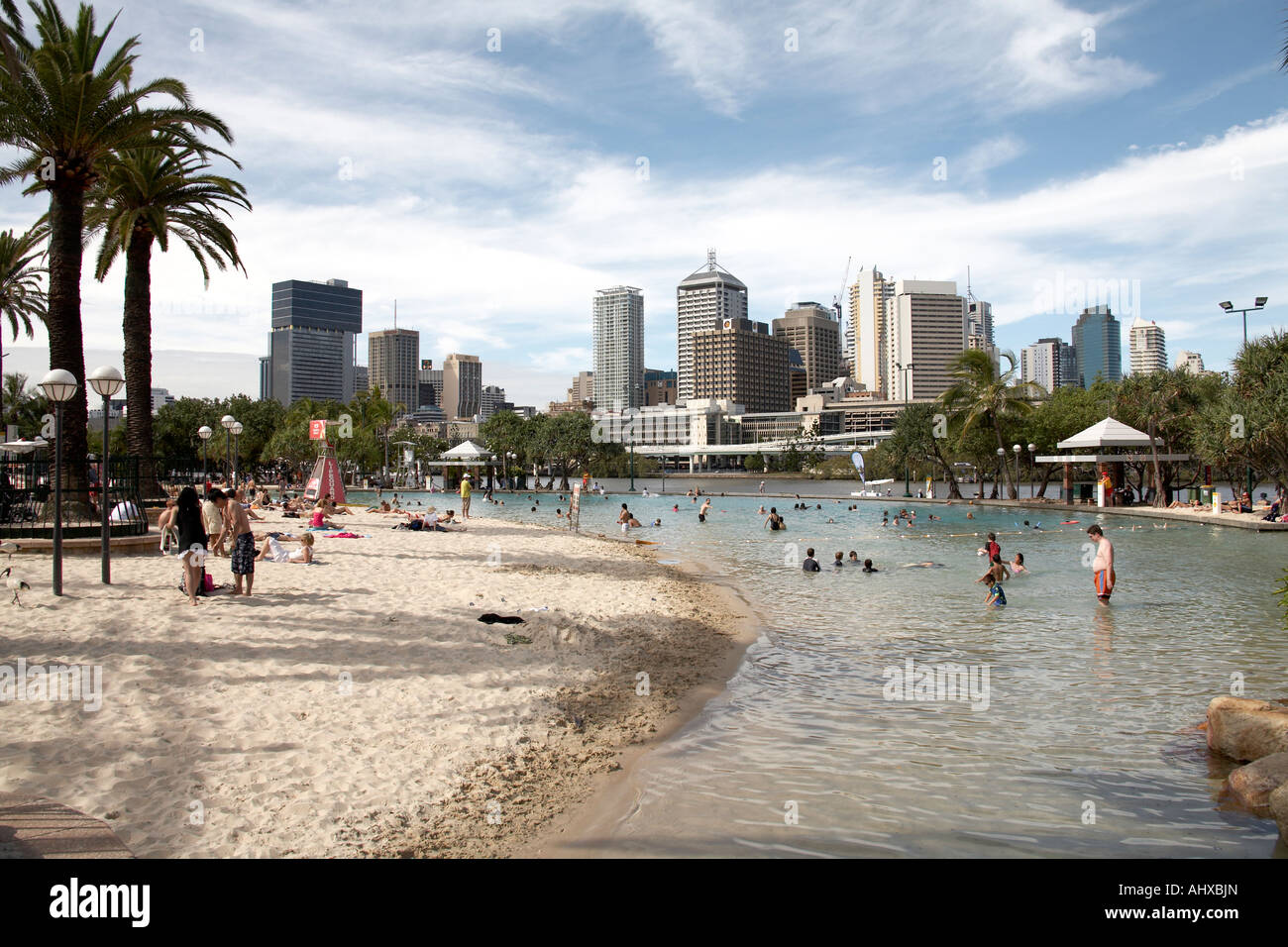 People swimming and sunbathing in summer on artificial Streets beach on