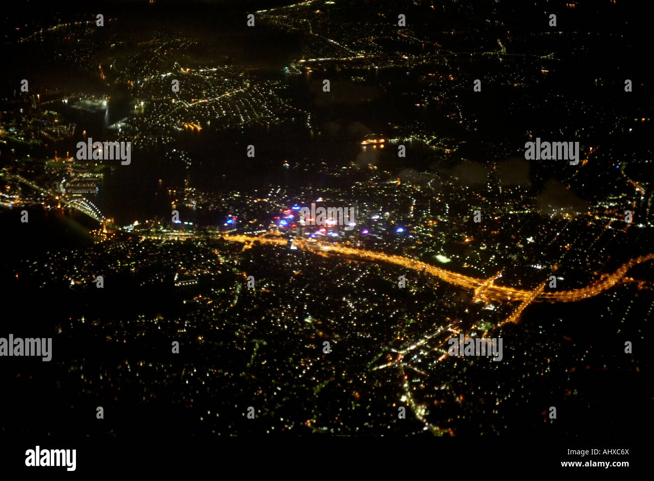 High level oblique aerial view at night from commercial aircraft of north Sydney New South Wales NSW Australia Stock Photo