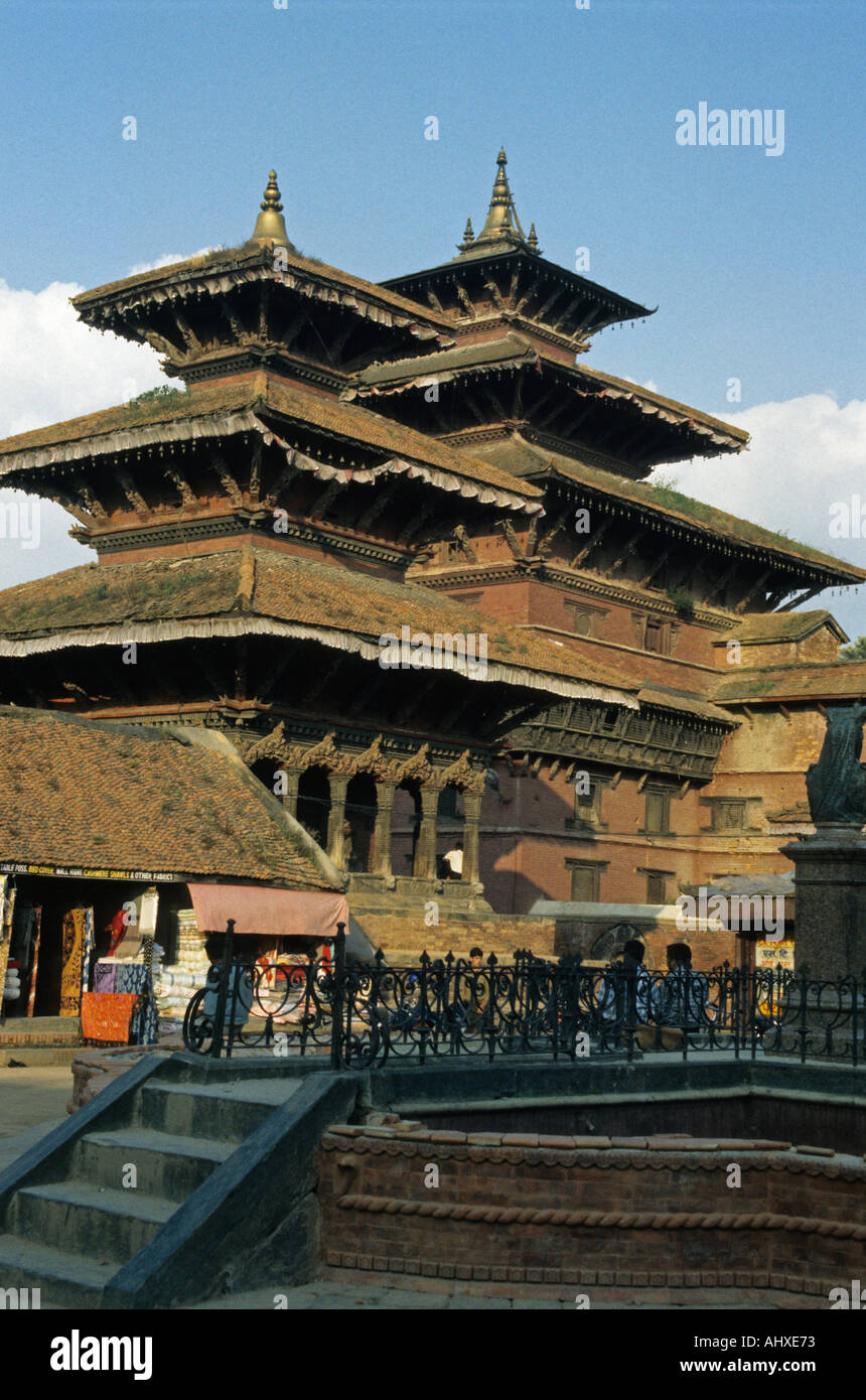Traditional Newari architecture of Patan Durbar Square temples in Kathmandu Valley, Nepal, showcasing intricate wood carvings and pagoda style. Stock Photo