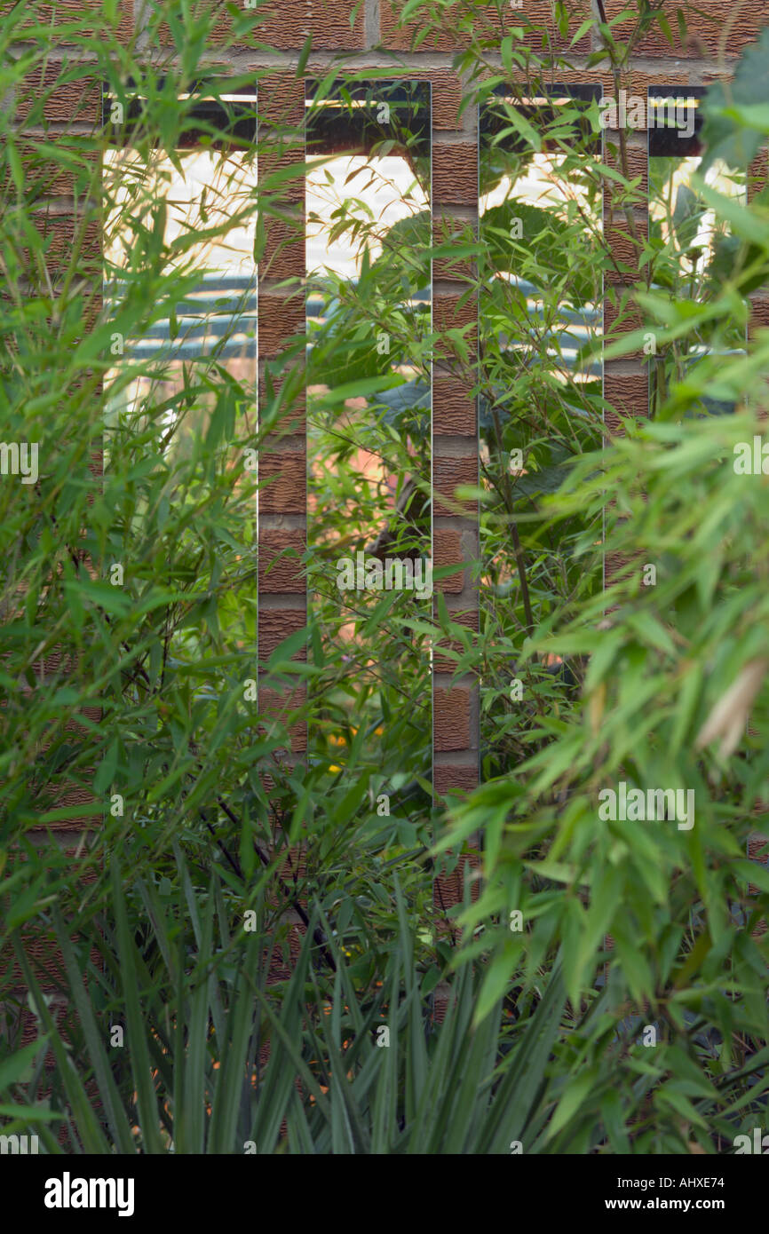 Gullifords Bank Matt Luft Somerset UK Mirrors attached to brick walls hidden behind bamboo Stock Photo