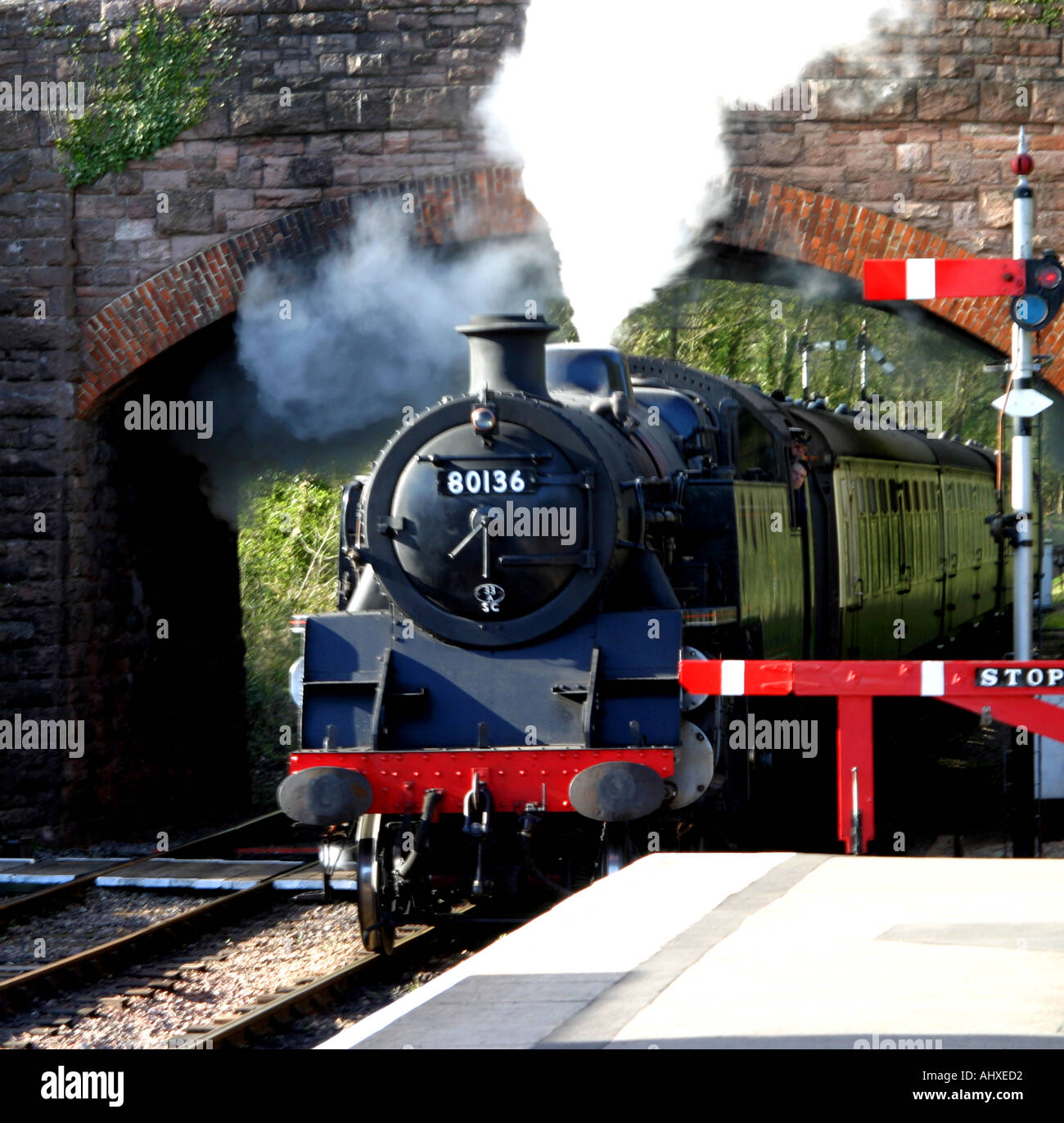 Steam Train locomotive 80136 coming into the station on the West Somerset Railway Stock Photo