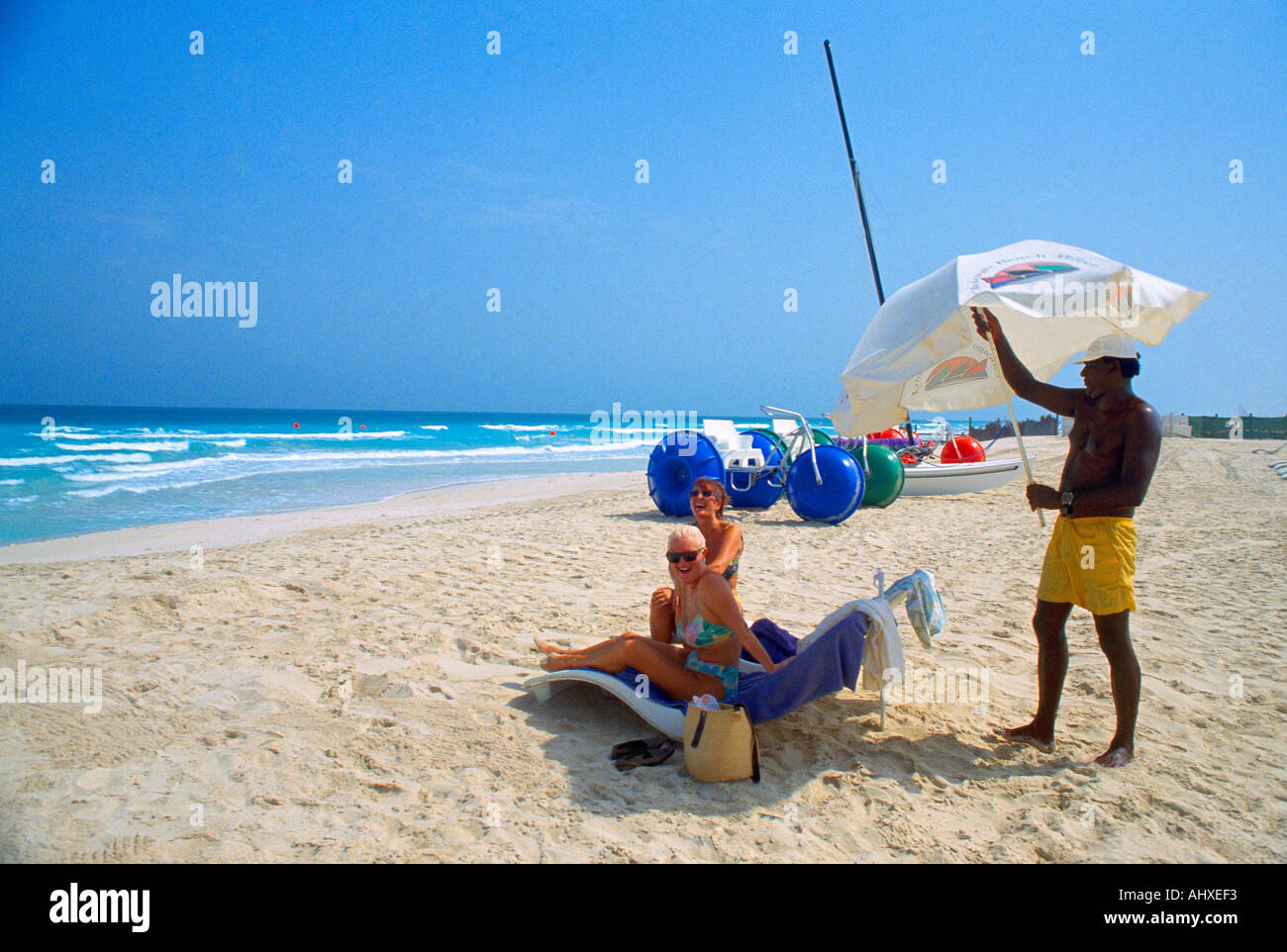 Dubai UAE Chicago Beach Hotel Beach Sunbeds Sunbathers Stock Photo