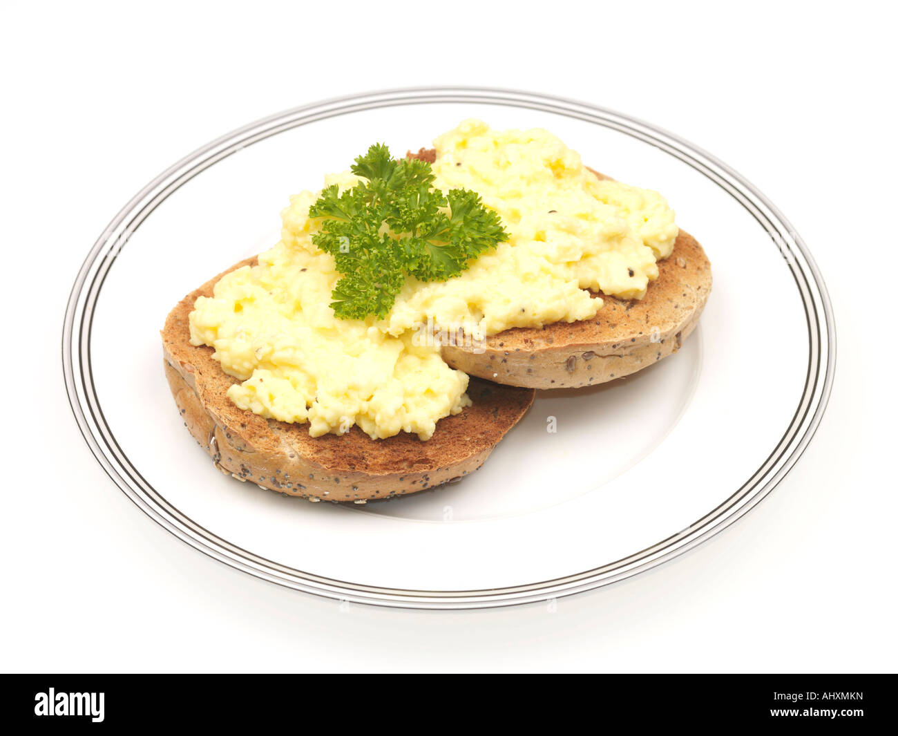 Wholemeal Bagel with Scrambled Eggs Stock Photo