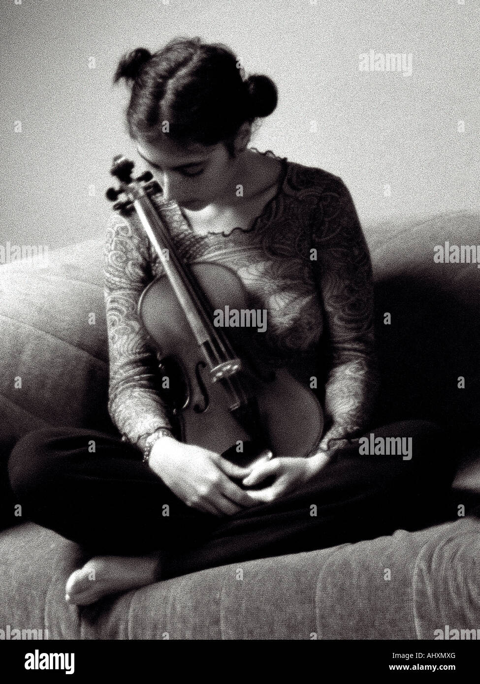 portrait of young woman sitting with violin Stock Photo - Alamy