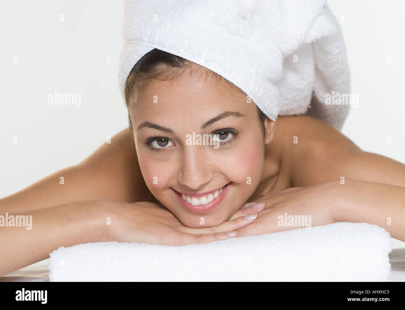 Smiling woman with towel on head Stock Photo