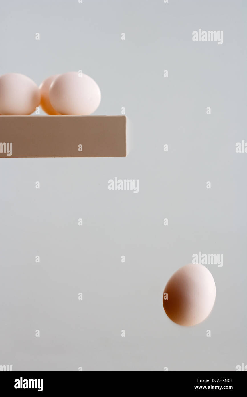 Egg falling off edge of table Stock Photo Alamy
