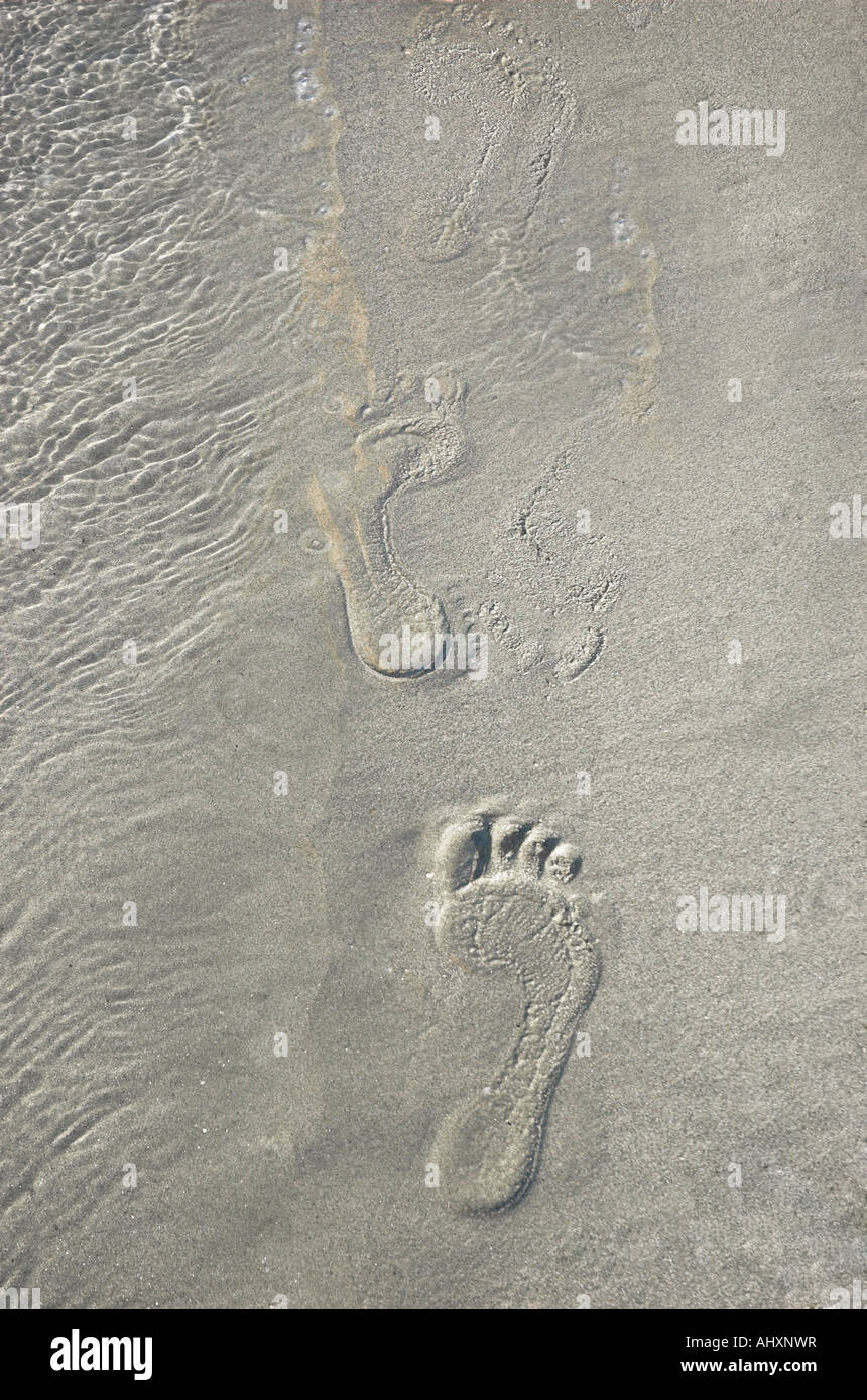 Footsteps in sand overhead view Turkey Gumbet August 2007 Stock Photo