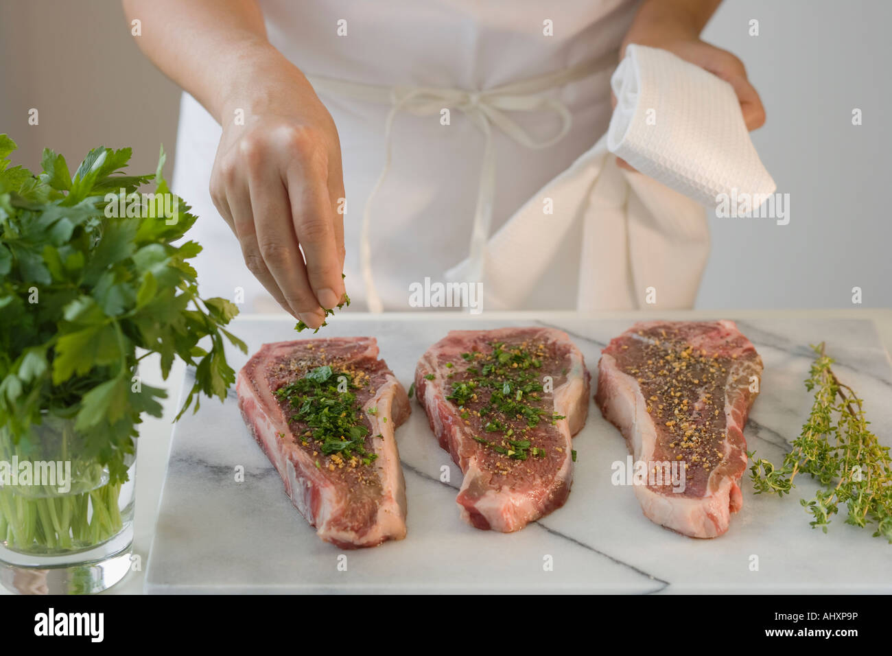 Seasoned pieces of meat on platter Stock Photo Alamy