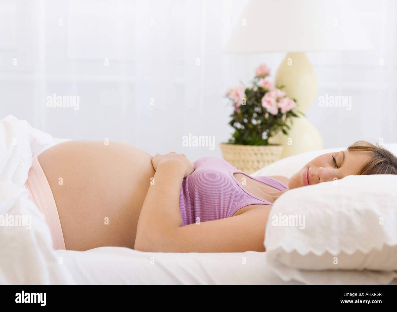 Pregnant Woman Sleeping In Bed Stock Photo Alamy