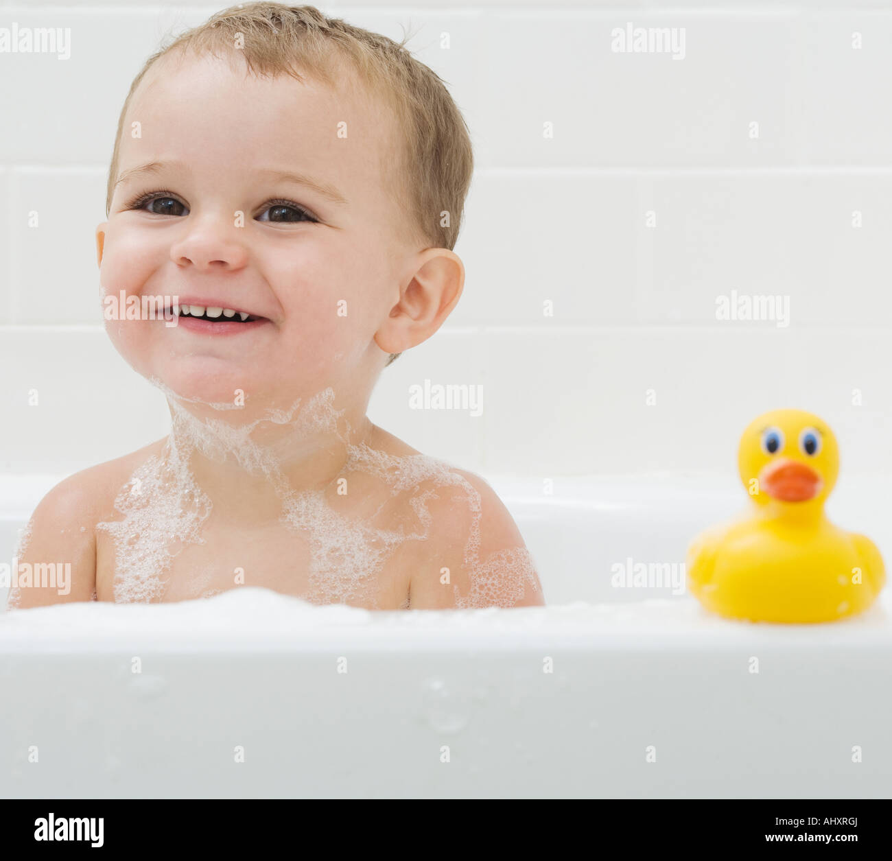 Baby and rubber duck in bath Stock Photo Alamy