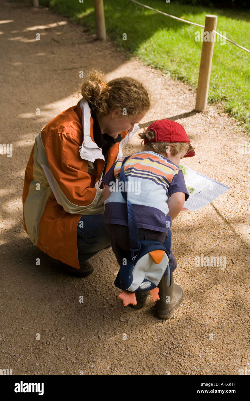 UK Wiltshire Stourton Stourhead House Gardens mother and young child looking at map Stock Photo