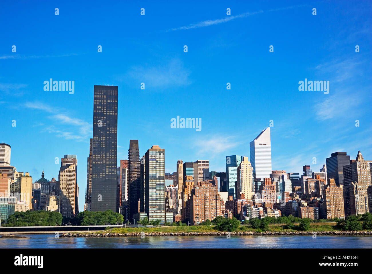 New York City skyline under blue sky Stock Photo - Alamy