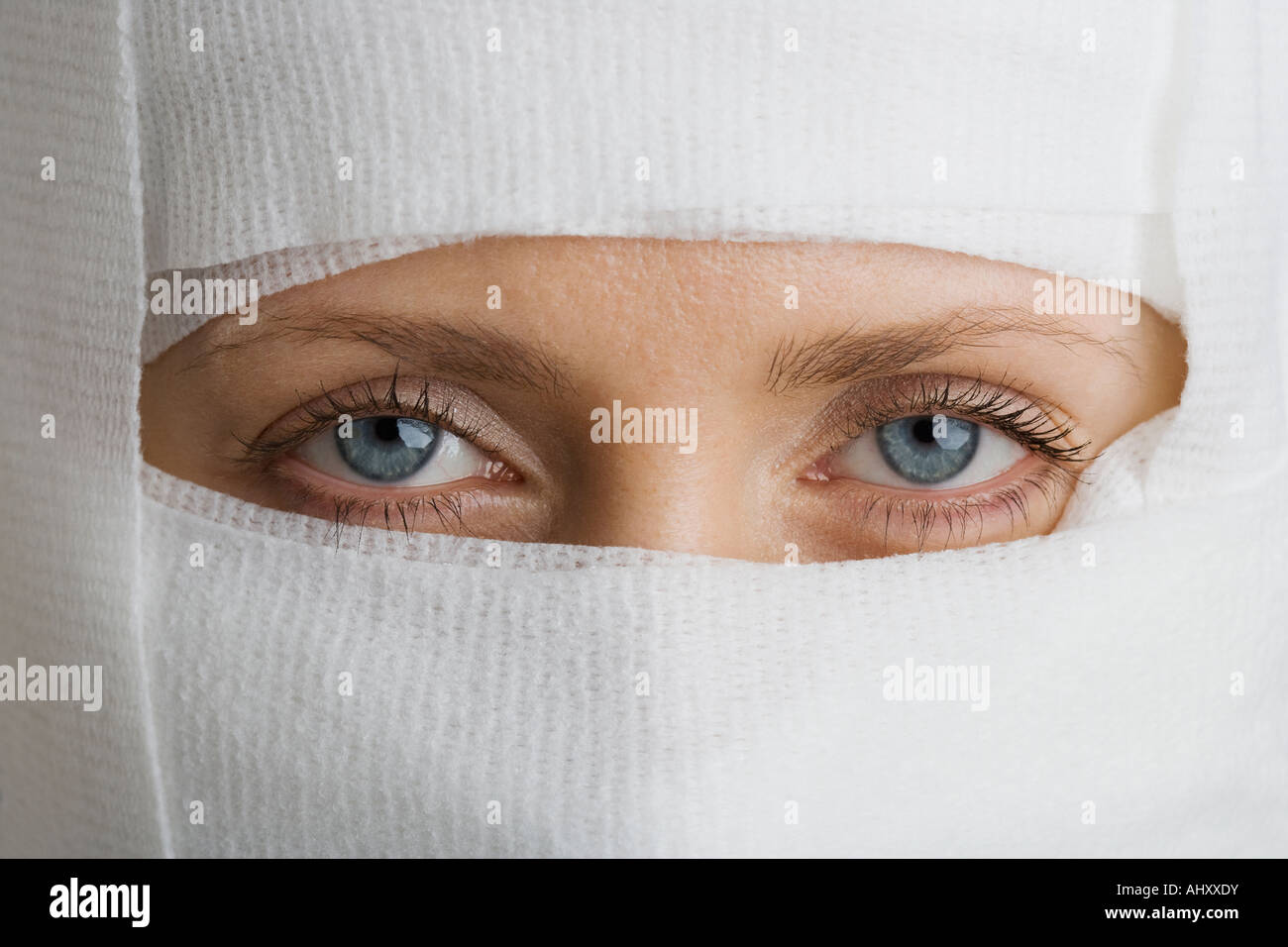 Woman’s face wrapped in bandages Stock Photo Alamy
