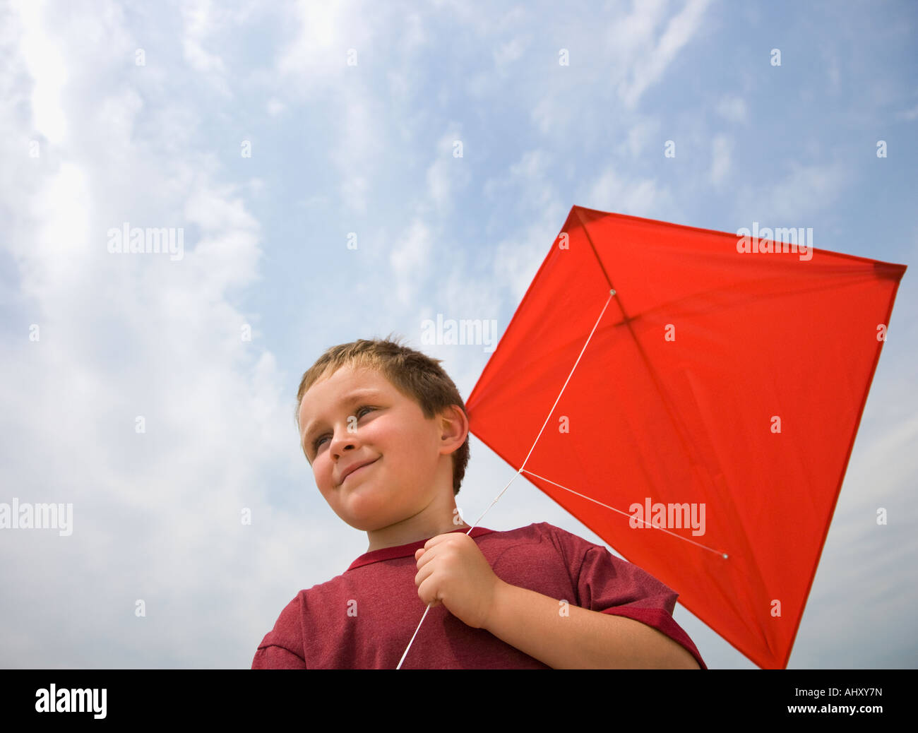 Boy holding kite Stock Photo Alamy