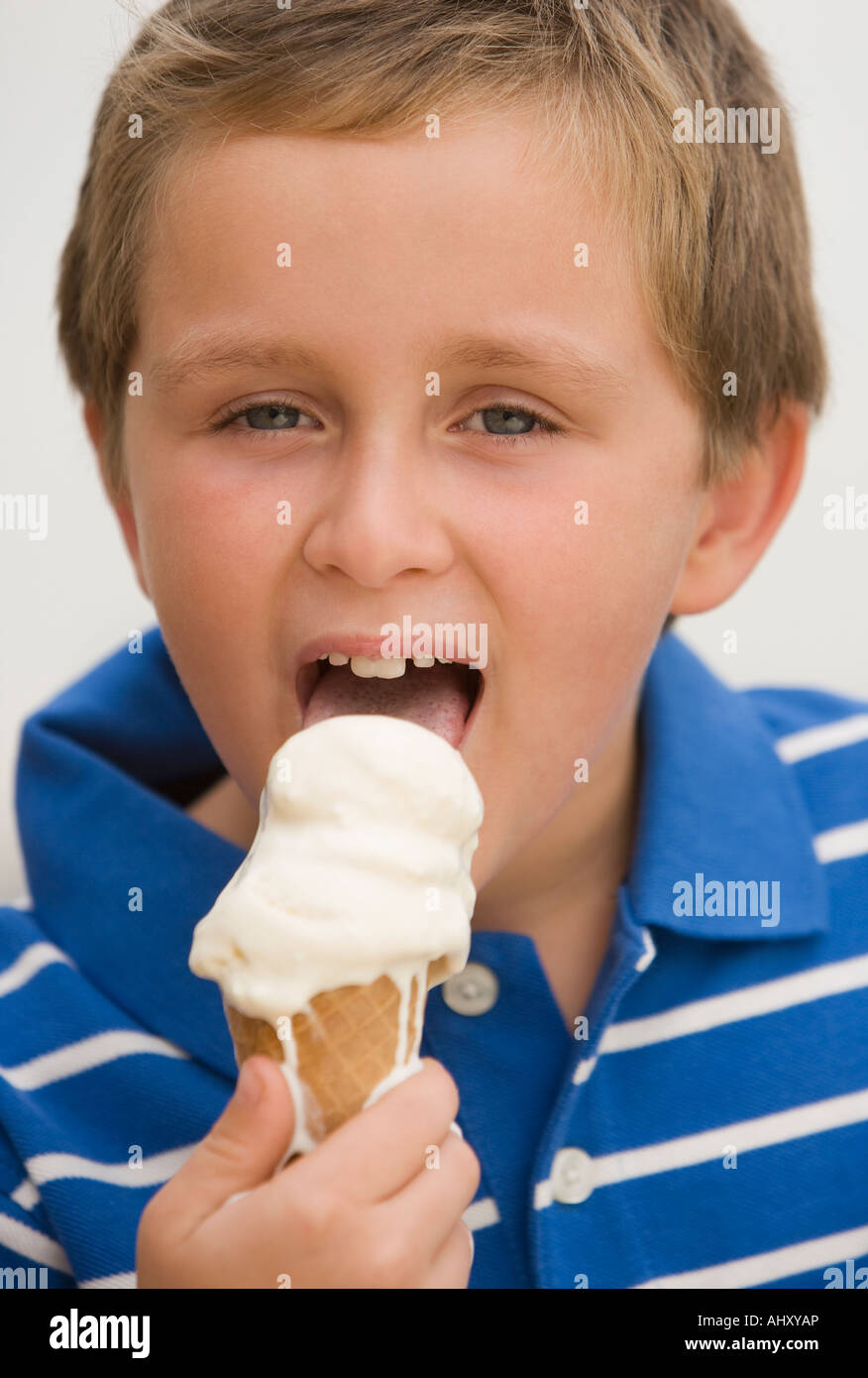 Boy eating ice cream cone Stock Photo - Alamy