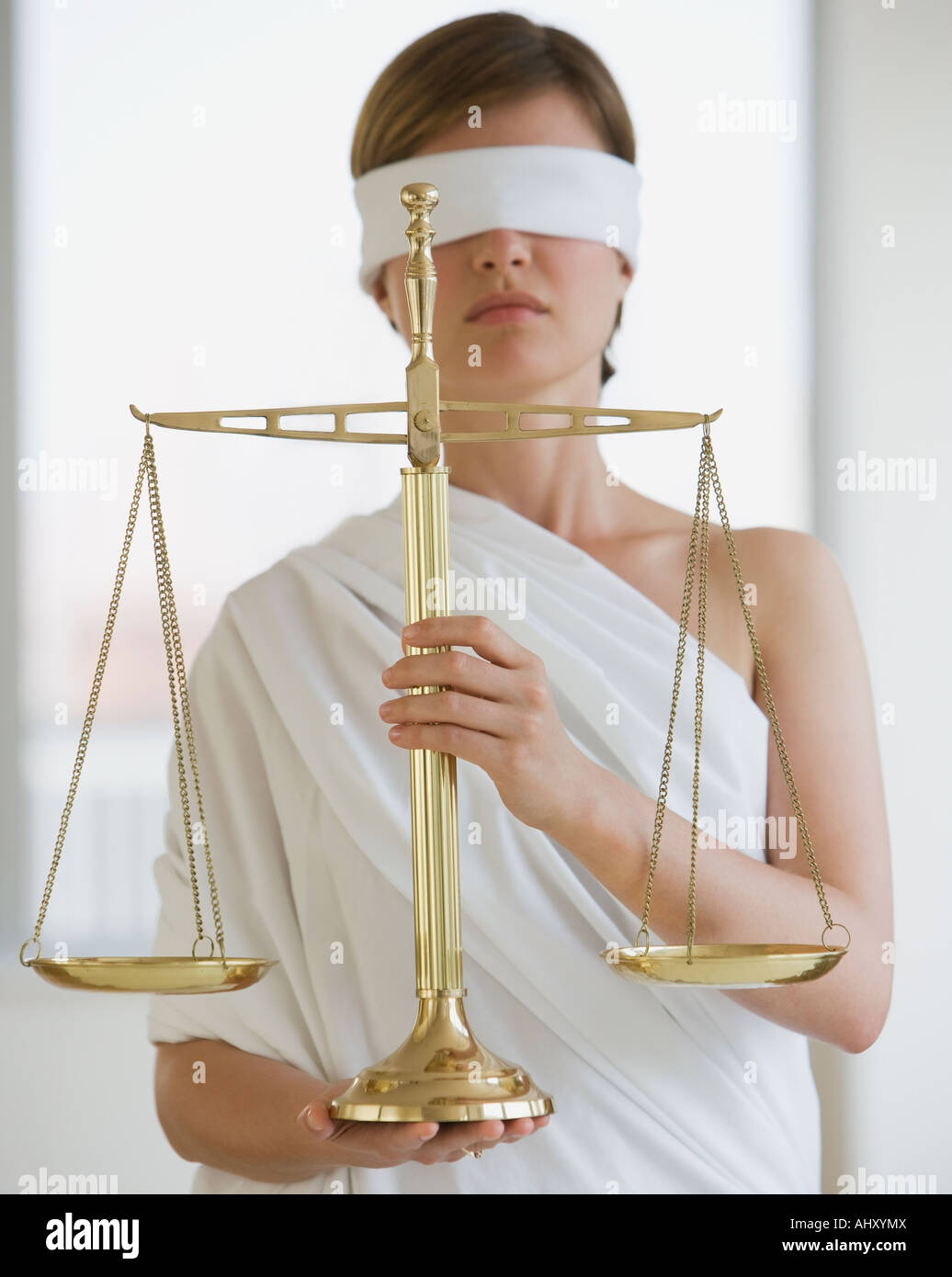 Blindfolded woman holding scales Stock Photo - Alamy