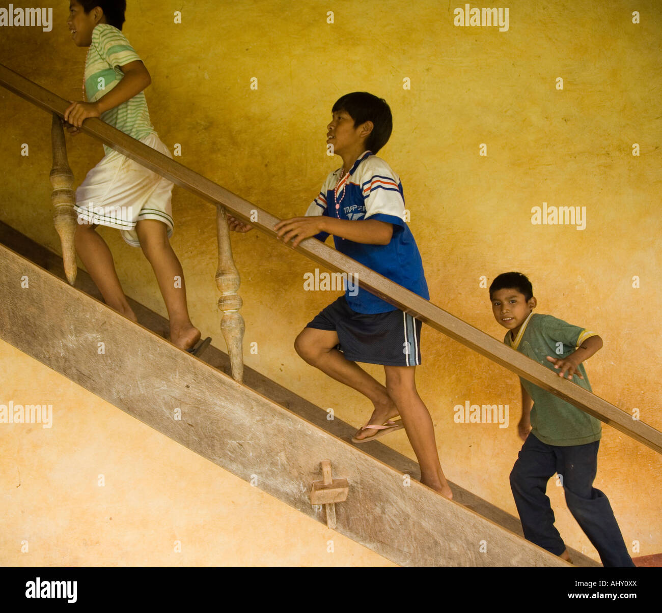 Bolivian children playing on the staircase at the mission of Santa Ana,  Bolivia Stock Photo