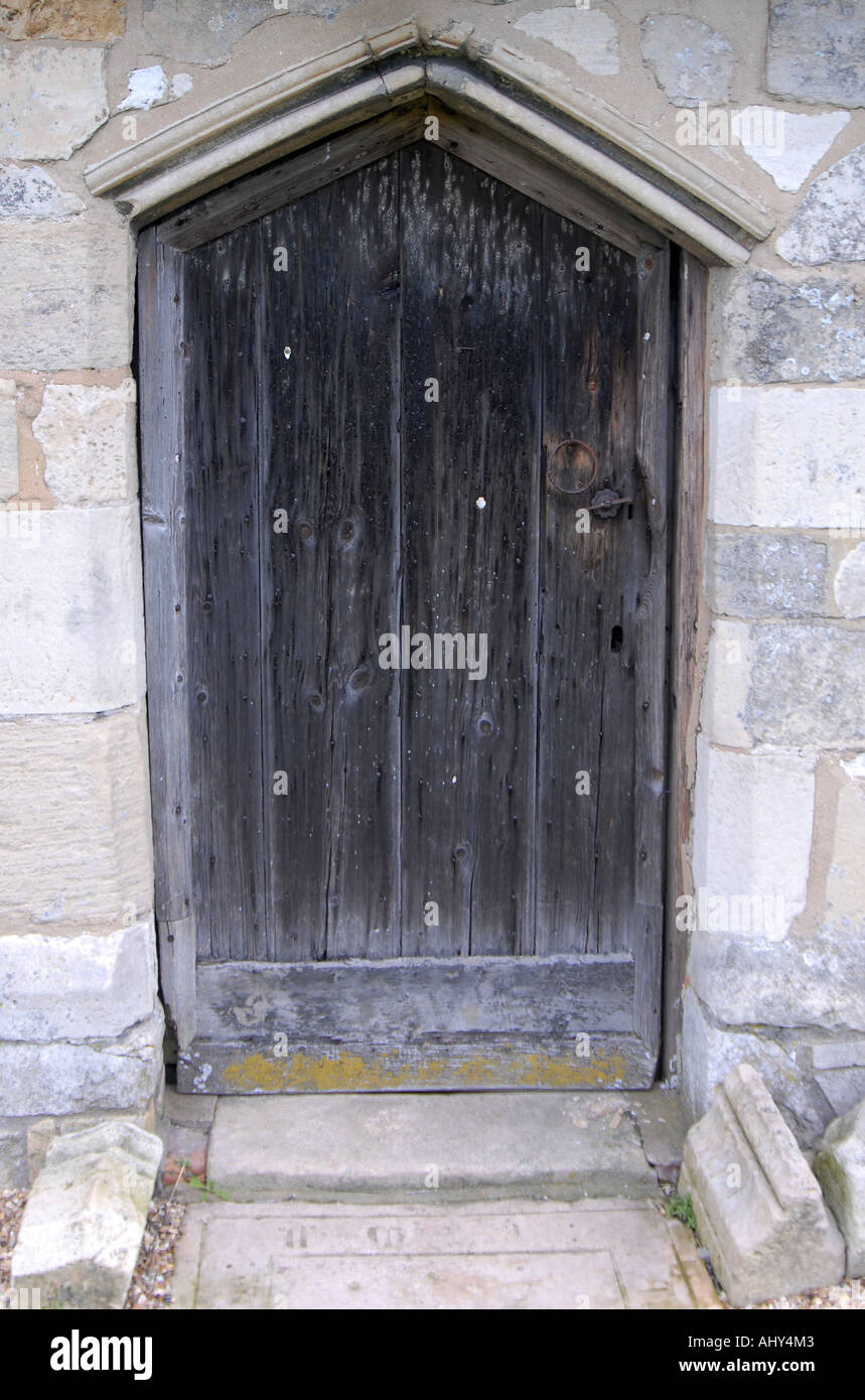 Ancient oak door to Englands only thatched church at Markby in Lincolnshire Stock Photo