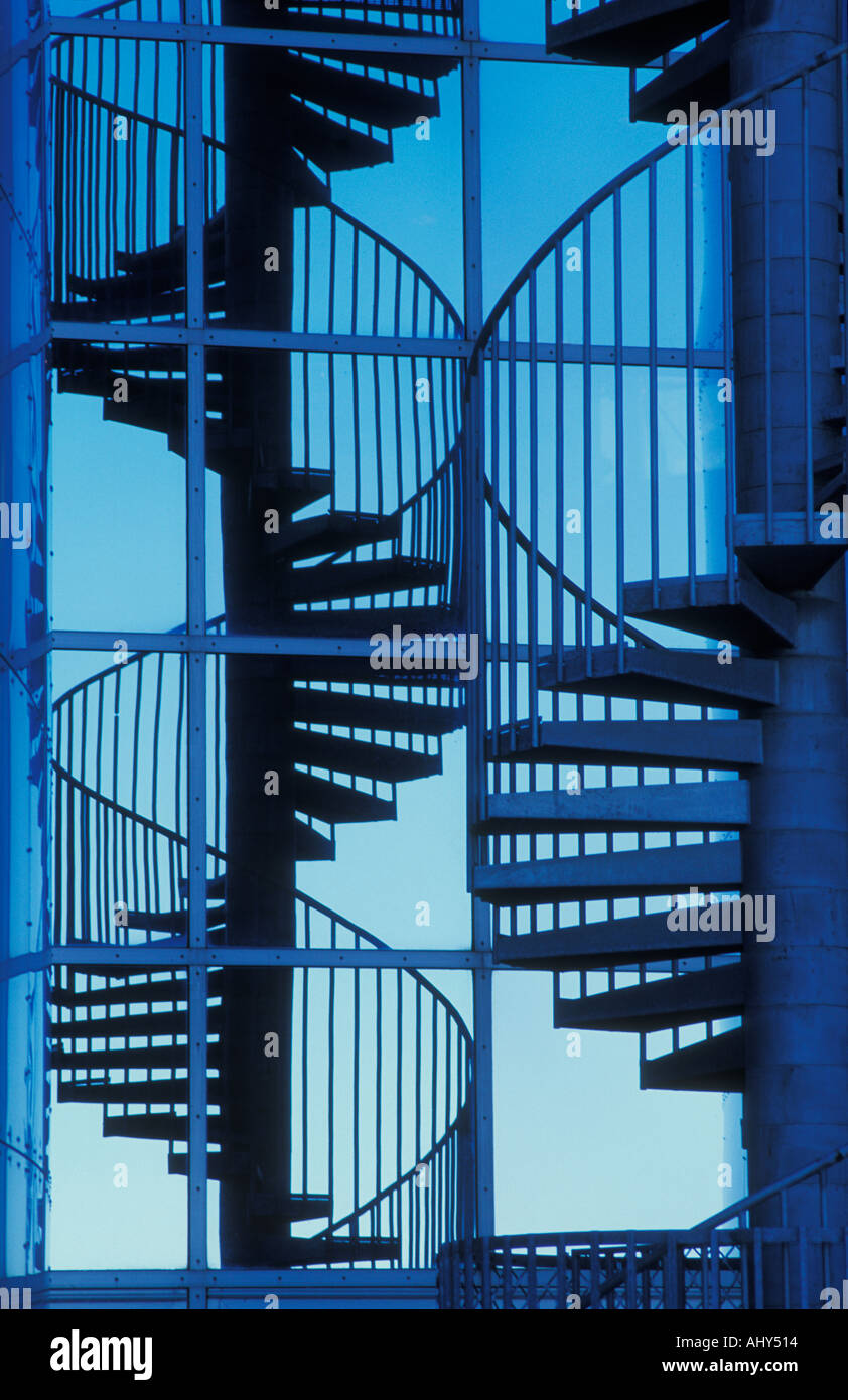 Blue sky and reflection of a Spiral staircase fire escape outside The Pearl Reykjavik Iceland Europe Stock Photo