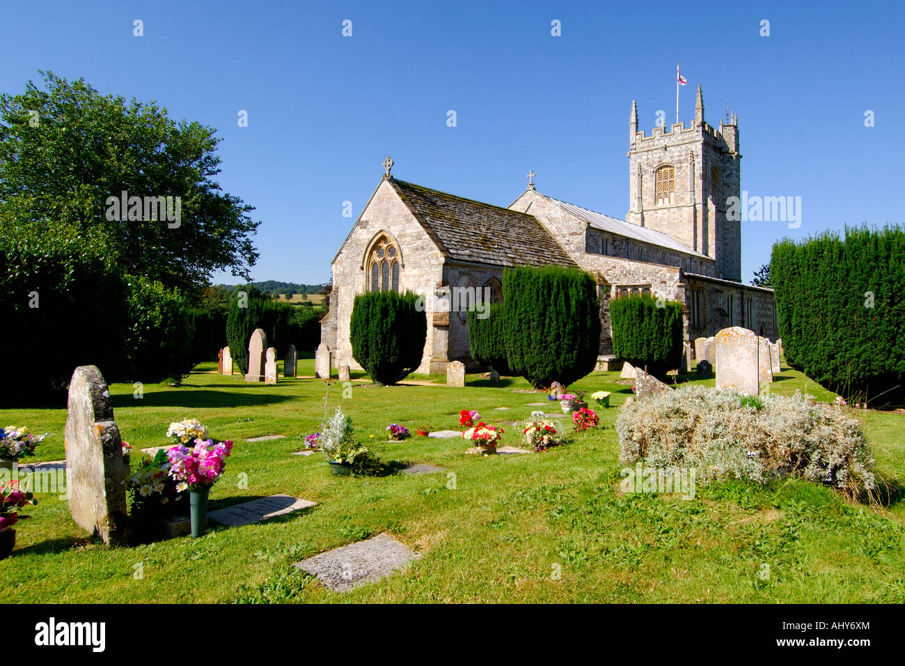The historically unique Church of St John the Baptist Bere Regis Dorset England on a bright sunny afternoon Stock Photo