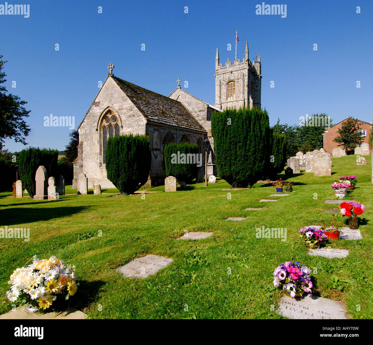 The historically unique Church of St John the Baptist Bere Regis Dorset England on a bright sunny afternoon Stock Photo