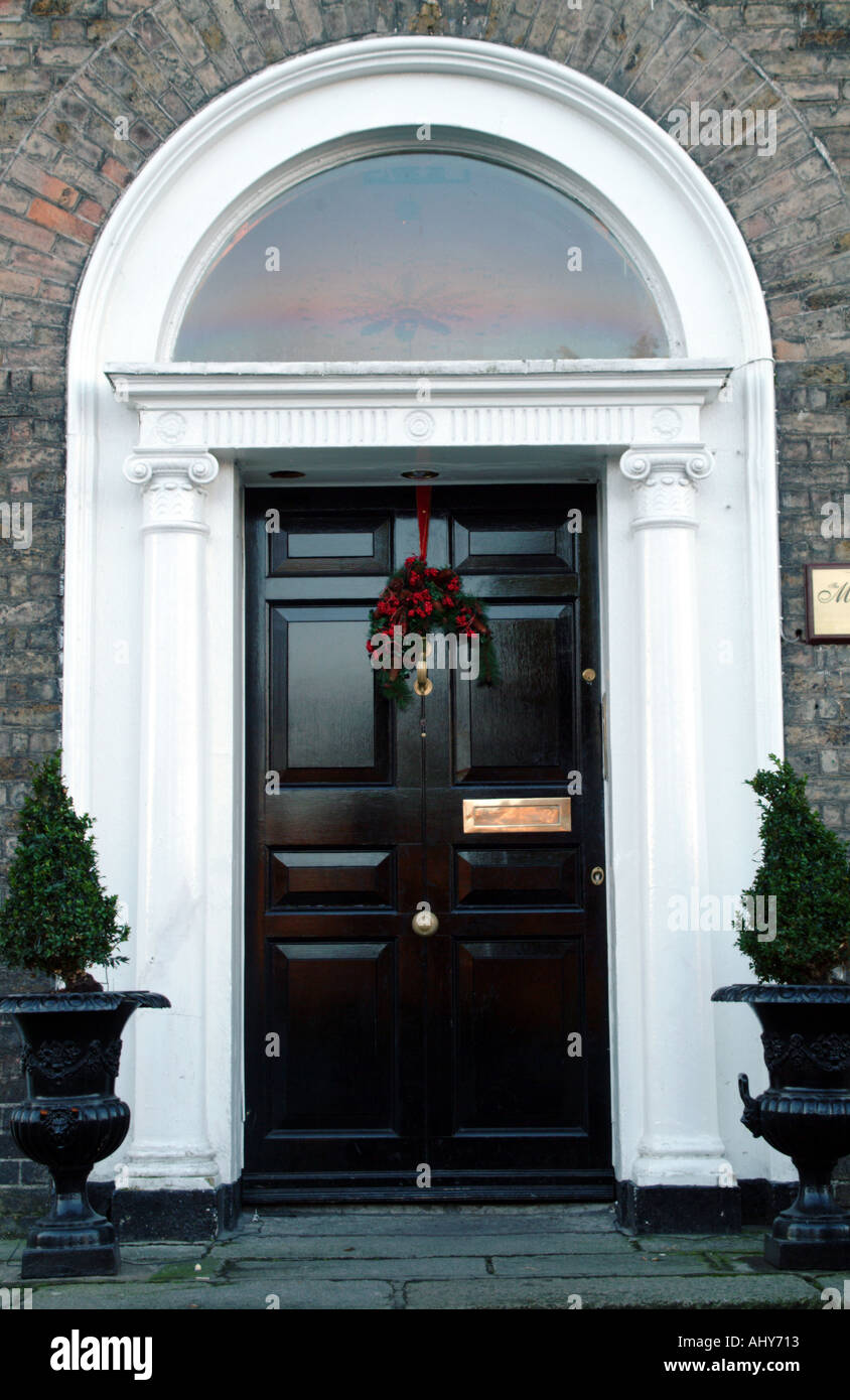 doorway on Merrion Square Dublin city centre Ireland Christmas decoration hangs from knocker Stock Photo