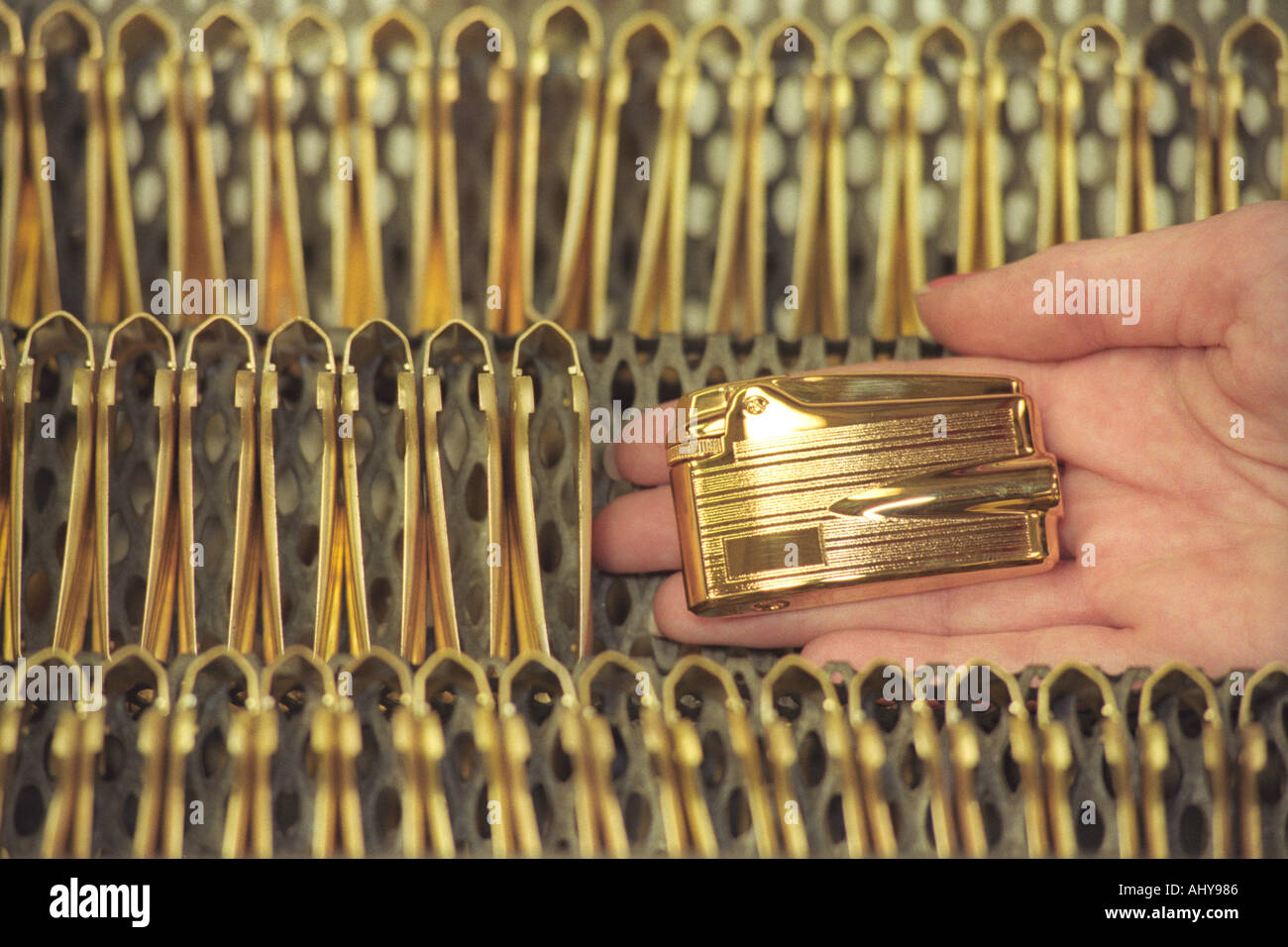 A gold plated Ronson Variflame Premier lighter pictured amongst body UKs only manufacturer of cigarette lighters Stock Photo - Alamy