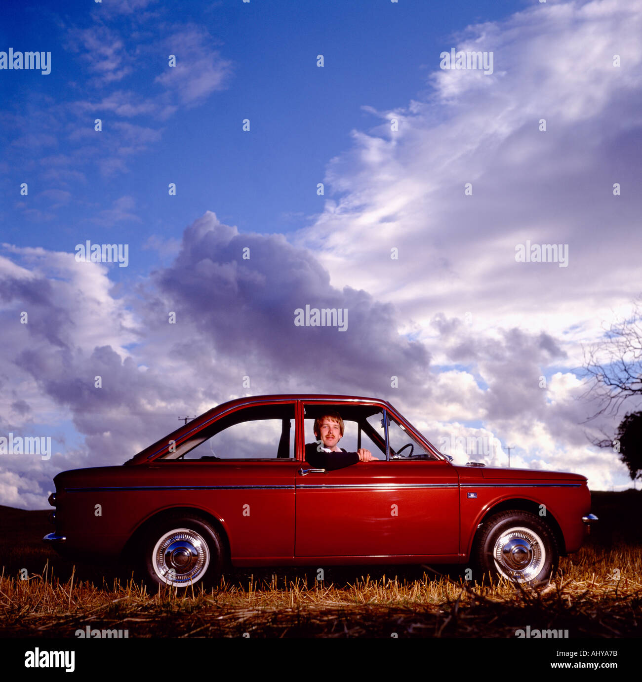 A Hillman Imp enthusiast in his car in England in Great Britain in the United Kingdom UK. Cars Hobby Modern Culture Classic Vintage Stock Photo