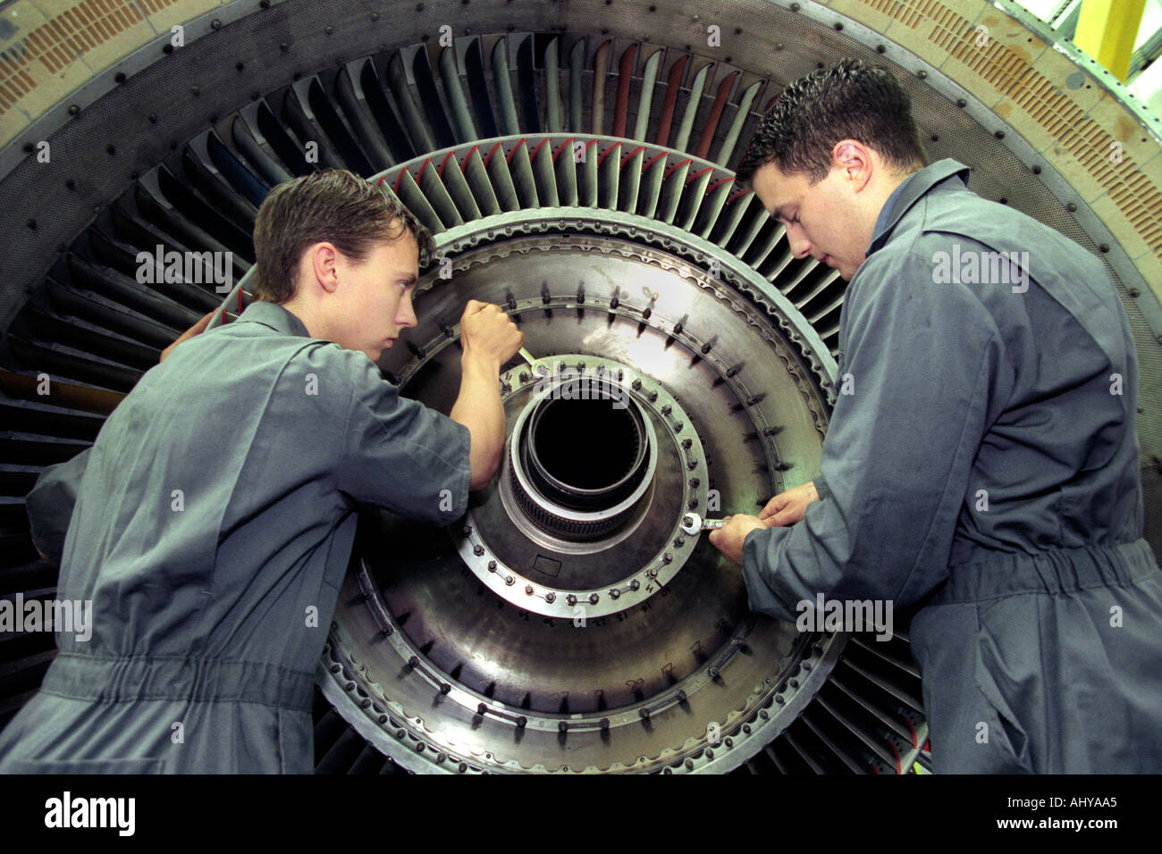 Modern Apprentices working on an aircraft jet engine UK Stock Photo
