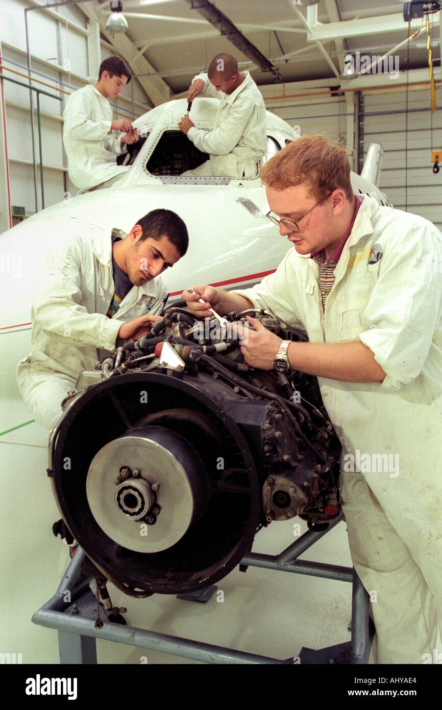 British Airways aircraft maintenance trainees working on a Hawker Siddley 125 jet at training facility in Barry South Wales UK Stock Photo