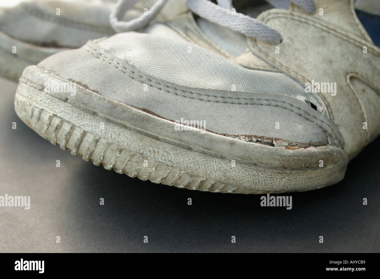 Closeup Of A Pair Of Dirty Old Worn Sneakers Or Running Shoes