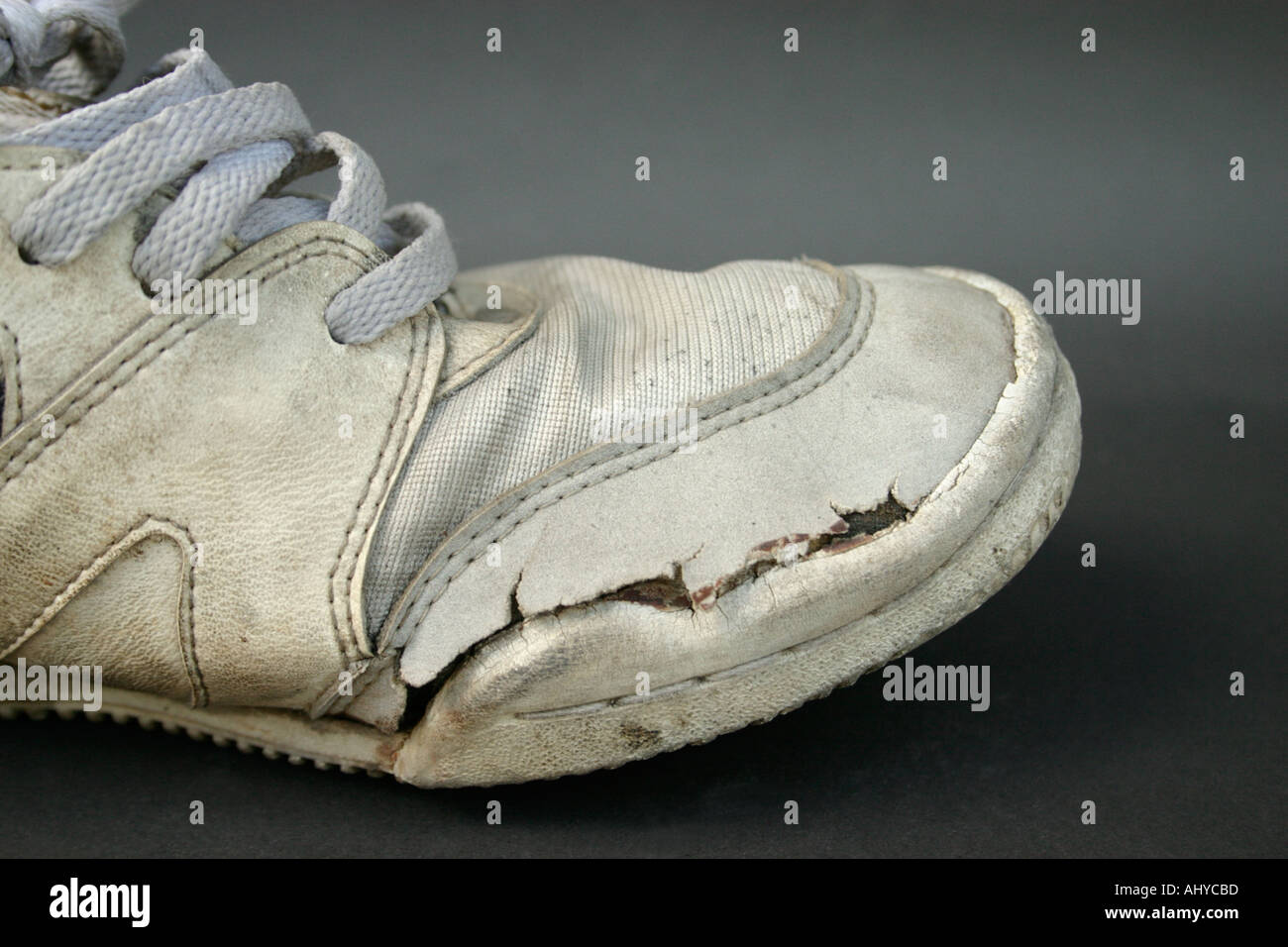 Side View Of Dirty Worn Old Sneakers Or Running Shoes Concept