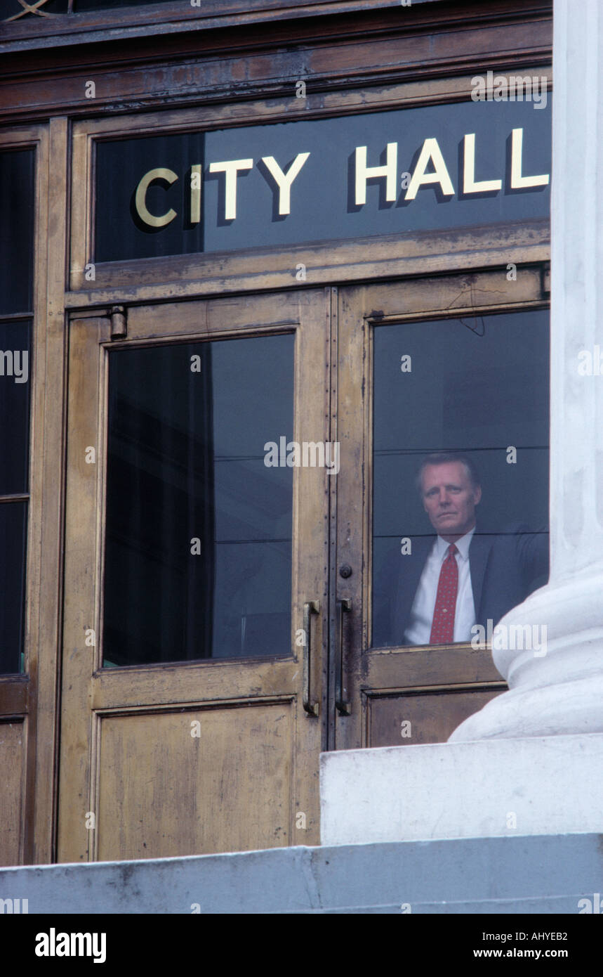 Caucasian man exiting city hall Stock Photo
