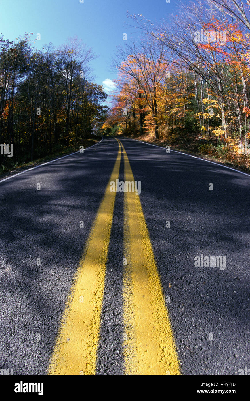 Double yellow line on Vermont Country roadway in autumn Stock Photo Alamy