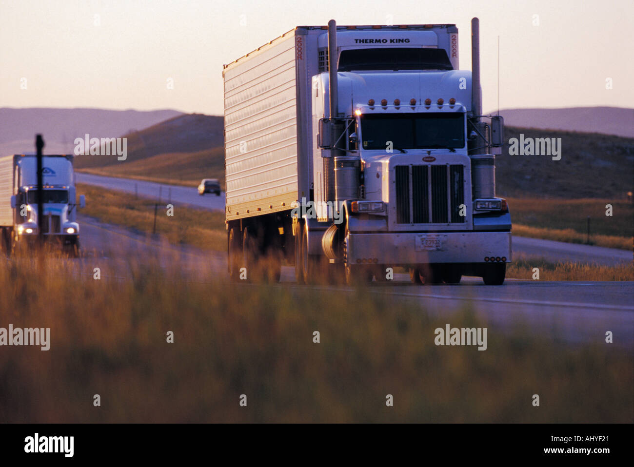 Tractor trailer barreling down interstate 90 highway in Wyoming USA