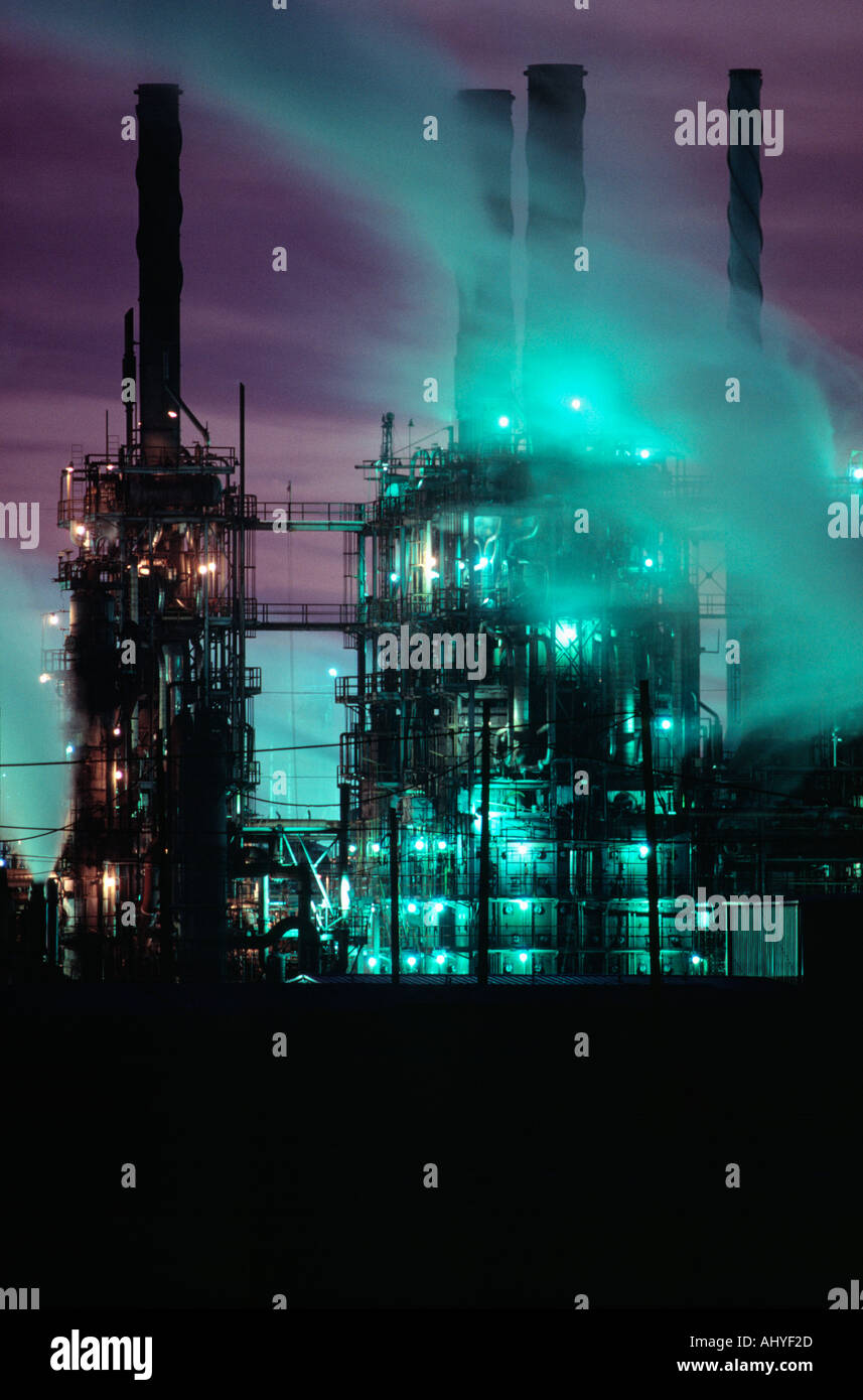 Chemical plant at night emitting noxous vapors Stock Photo